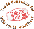A red and white sign with the words " trade for travel ".