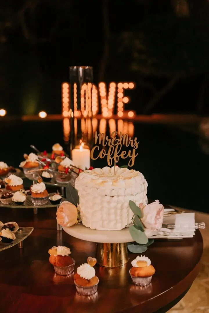 A cake and some candles on top of a table.