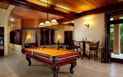 A pool table in the middle of a room.